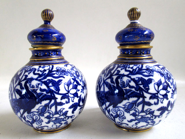 Appraisal: PAIR ROYAL CROWN DERBY PORCELAIN LIDDED VESSELS in the Peacock