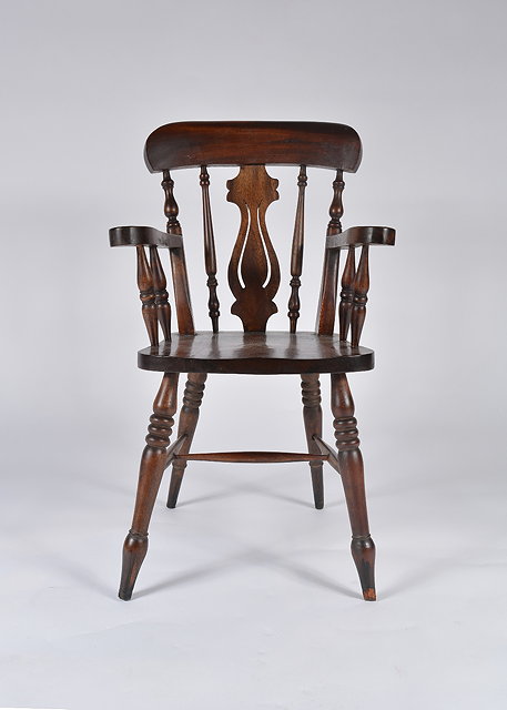 Appraisal: A th Century child's mahogany Windsor type armchair