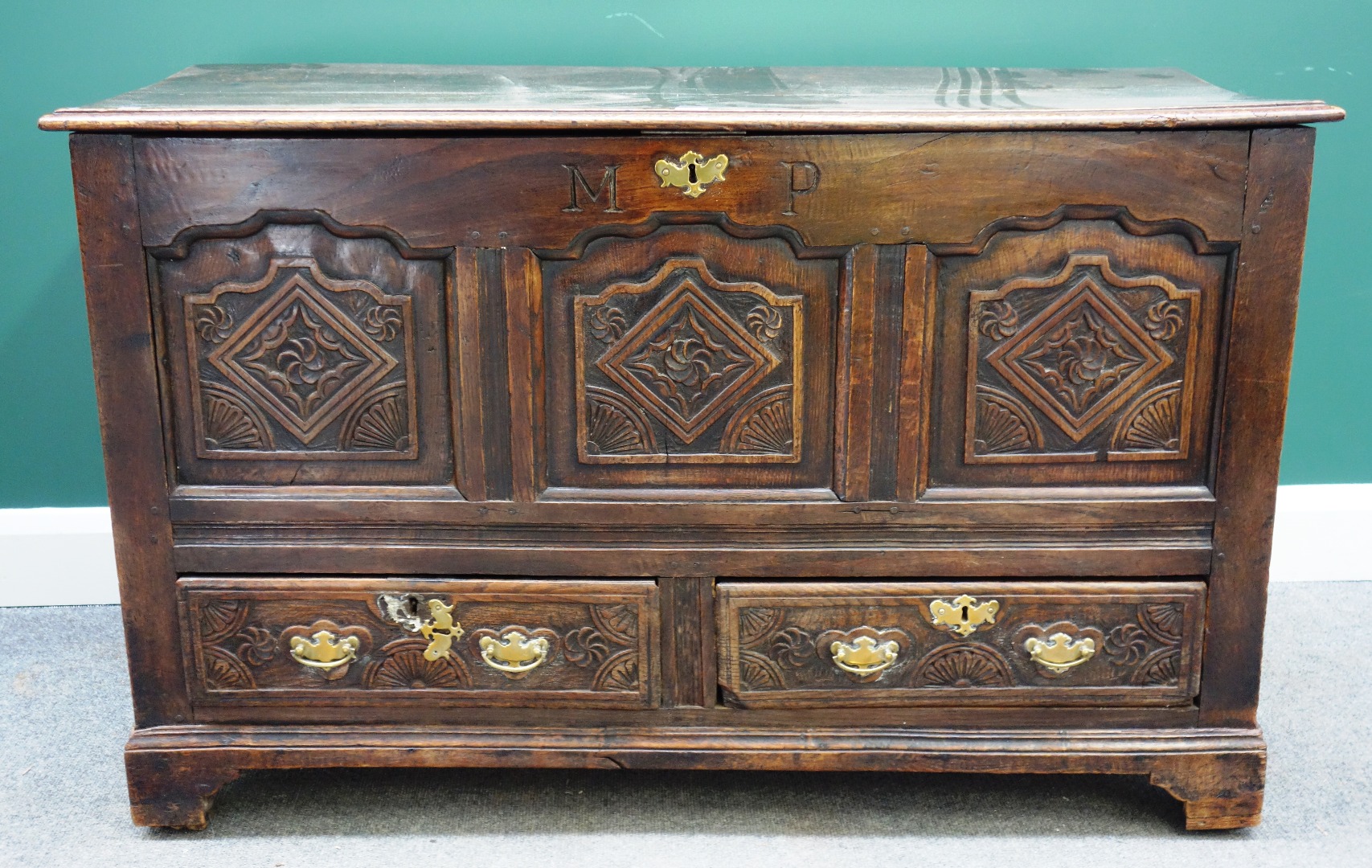 Appraisal: An th century carved oak mule chest with triple panel