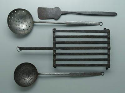 Appraisal: Four iron kitchen implements footed gridiron hand wrought and peened