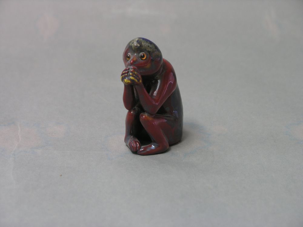 Appraisal: A Bernard Moore model of a seated chimpanzee veined glaze