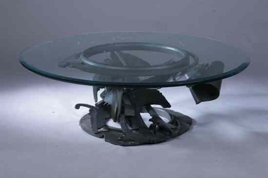 Appraisal: ALBERT PALEY CONTEMPORARY FORGED AND FABRICATED STEEL GLASS-TOP COFFEE TABLE