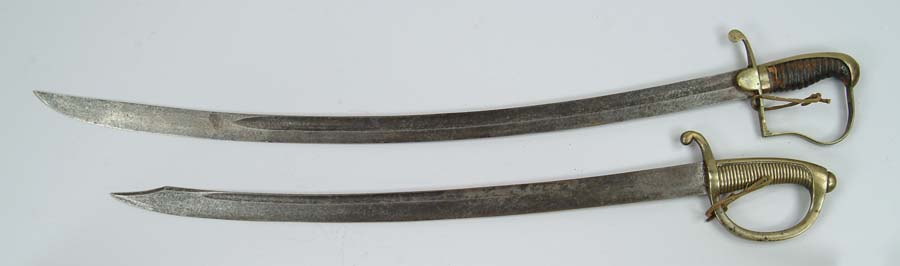 Appraisal: TWO EARLY SWORDS European - l unmarked with brass handle