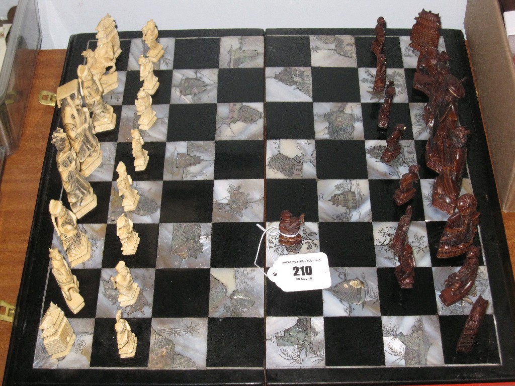 Appraisal: Carved and stained ivory chess set with mother of pearl