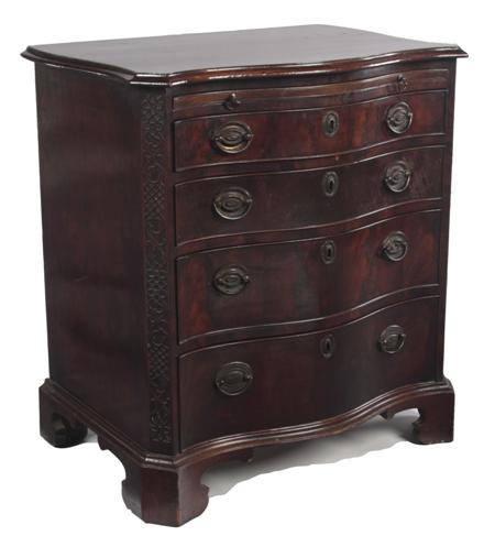 Appraisal: A th century mahogany serpentine chest of small proportions the