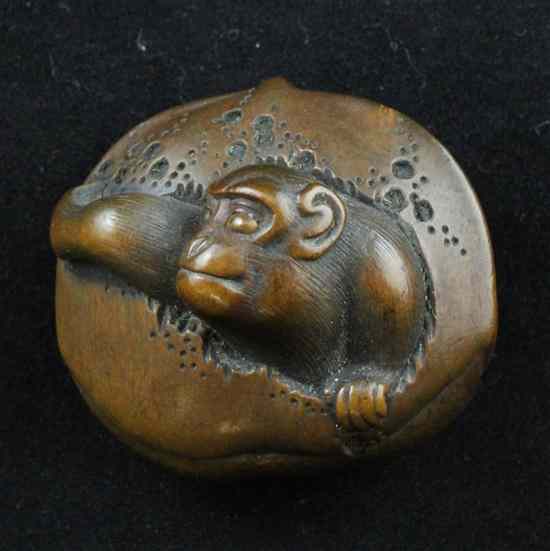 Appraisal: An Edo period hardwood netsuke carved as a monkey in