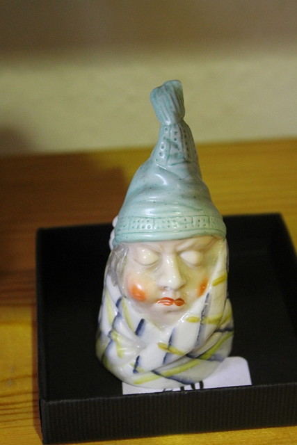 Appraisal: A ROYAL WORCESTER PORCELAIN CANDLE SNUFFER in the form of