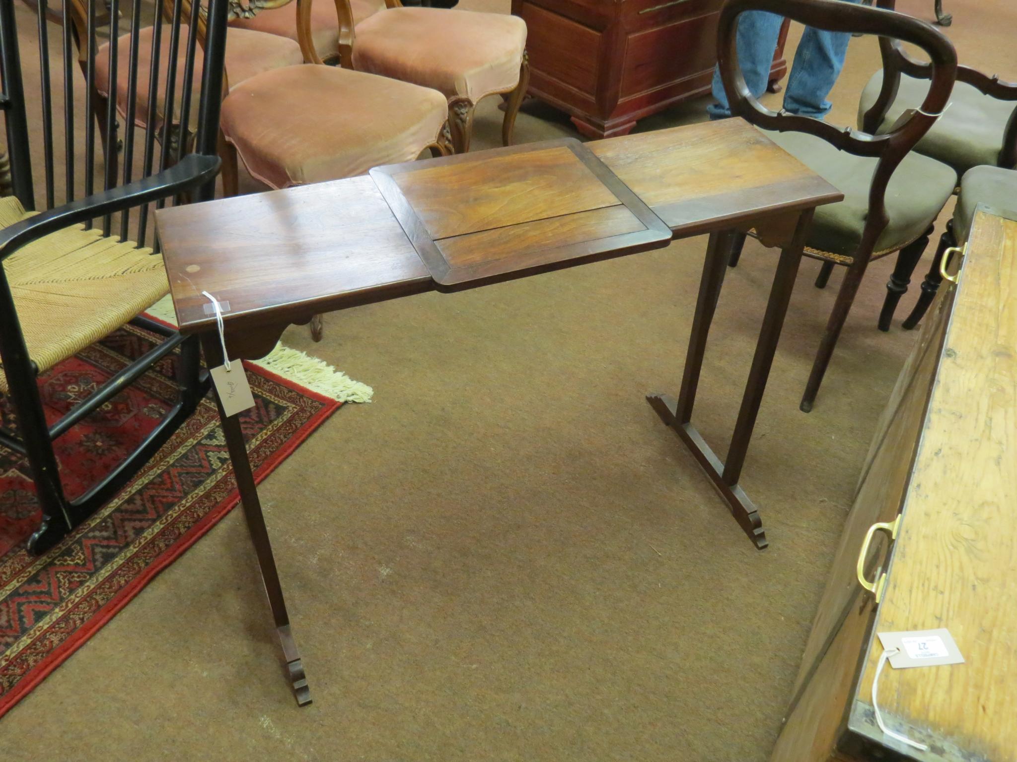 Appraisal: A Victorian walnut clerk's table with central height-adjustable writing surface