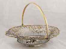 Appraisal: A Georgian swing handled parcel gilt silver bread basket the