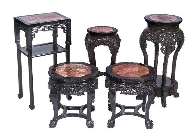 Appraisal: A CHINESE CARVED CHERRYWOOD URN STAND inset marble top on