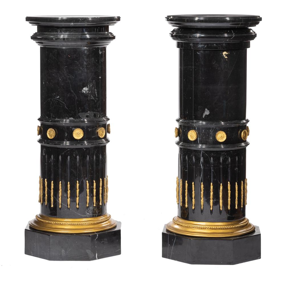 Appraisal: Pair of Gilt Bronze-Mounted Black Marble Pedestals molded circular top