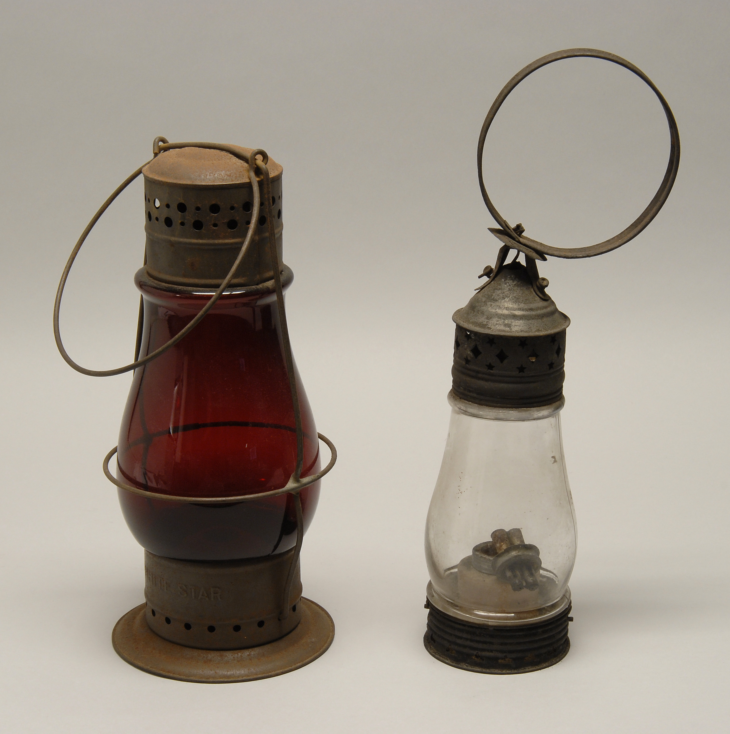 Appraisal: TWO ANTIQUE AMERICAN OIL LANTERNS One with colorless glass height