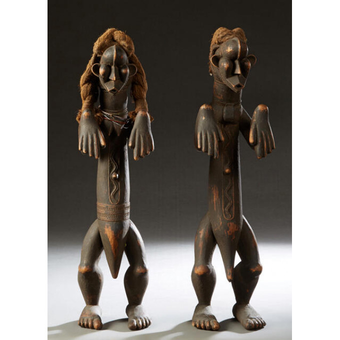 Appraisal: Pair of African Carved Wood Fertility Figures th c with