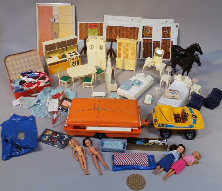 Appraisal: A quantity of Sindy dolls and accessories to include caravan