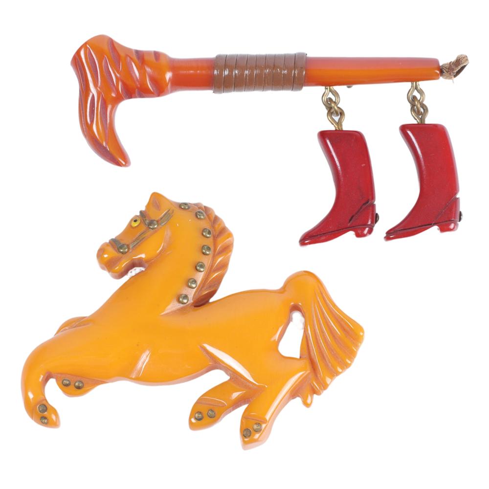 Appraisal: TWO BAKELITE BROOCHES HORSE AND RIDING CROP BOOTS H X