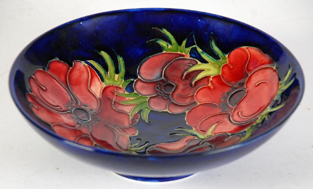 Appraisal: MOORCROFT ANEMONE PATTERN TUBE LINED CIRCULAR DISH of footed form