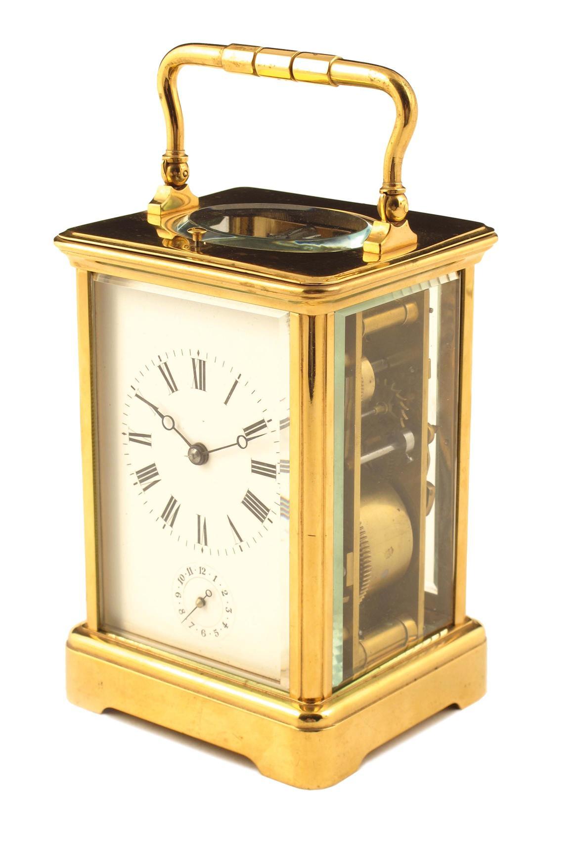 Appraisal: A French gilt brass repeating carriage clock with alarum by