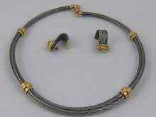 Appraisal: A yellow metal tests ct gold and steel necklace with