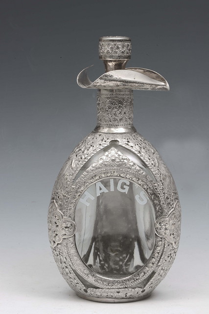 Appraisal: A HAIG GLASS WHISKY DECANTER overlaid in Chinese white metal