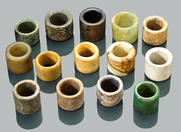 Appraisal: A group of fourteen archer's rings Carved from various hardstones