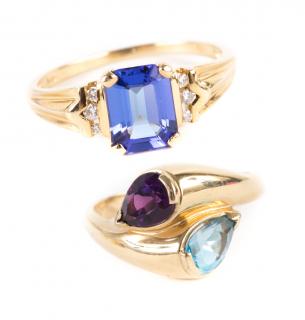 Appraisal: K bypass ring with pear shape blue topaz and amethyst