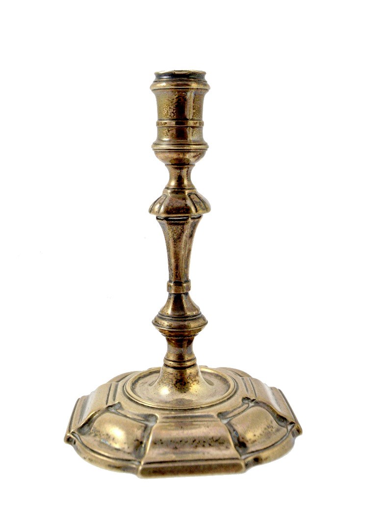 Appraisal: A George II silver taper stick with a knopped stem