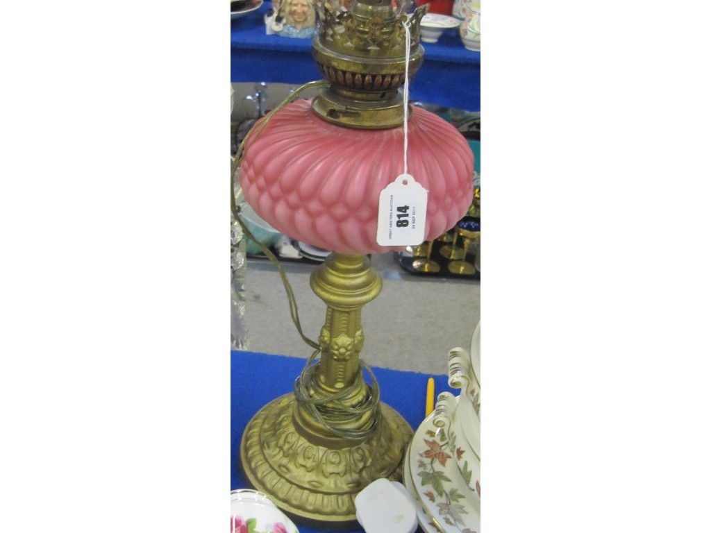 Appraisal: Victorian paraffin lamp with cranberry opaque glass reservoir converted