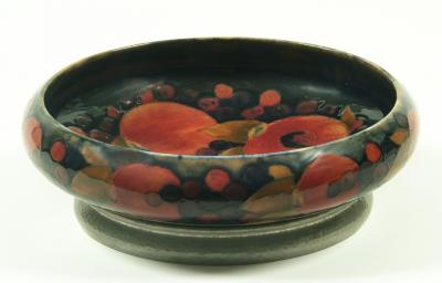 Appraisal: A MOORCROFT POTTERY TUDRIC BOWL of shallow circular form tube