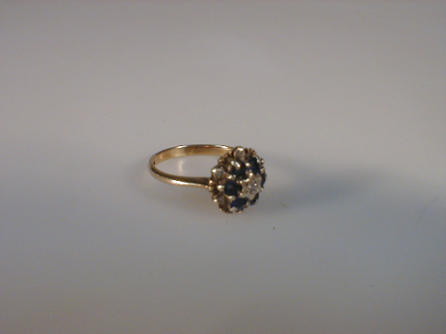 Appraisal: A diamond and sapphire cluster ring set in ct yellow