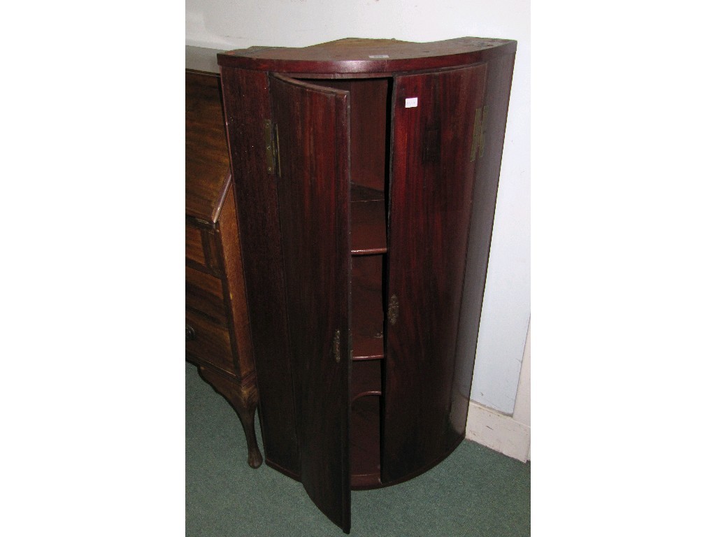 Appraisal: Bow fronted corner cabinet