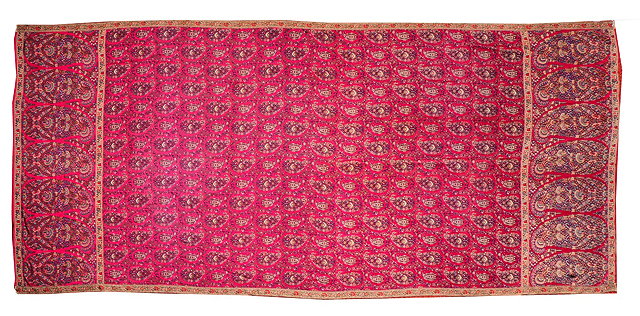 Appraisal: A KASHMIR STYLE HAND WOVEN SHAWL with repeating decoration on