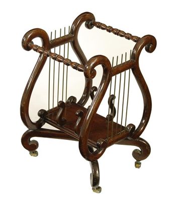 Appraisal: A late th century mahogany canterbury of lyre form with