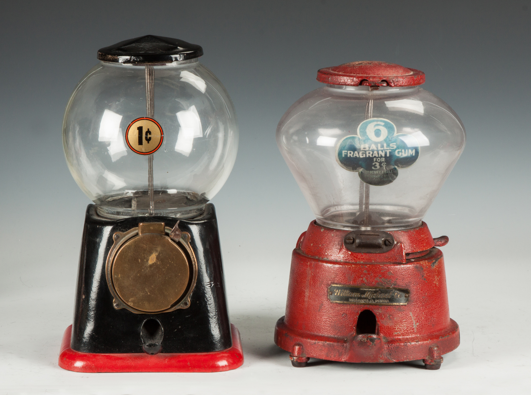 Appraisal: Two Vintage Gumball Machines L Unmarked cast iron brass R