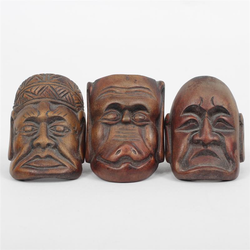 Appraisal: Group of three carved wood Kabuki mask rings H x