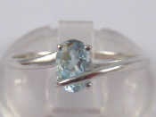 Appraisal: A white metal tests carat gold blue topaz ring Size