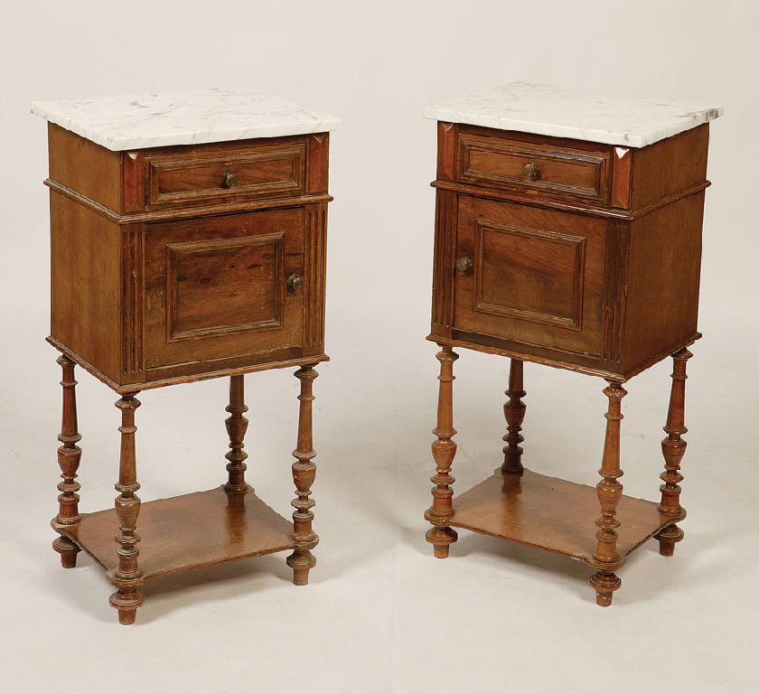 Appraisal: A PAIR OF FRENCH WALNUT BEDSIDE CUPBOARDS with rectangular veined