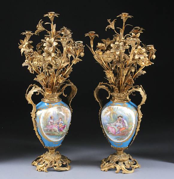 Appraisal: A pair of Sevres style porcelain gilt bronze candelabra th