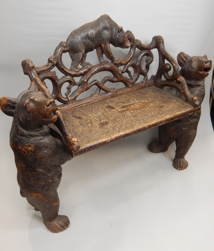 Appraisal: A late th-early thC Black Forest linden wood bench carved