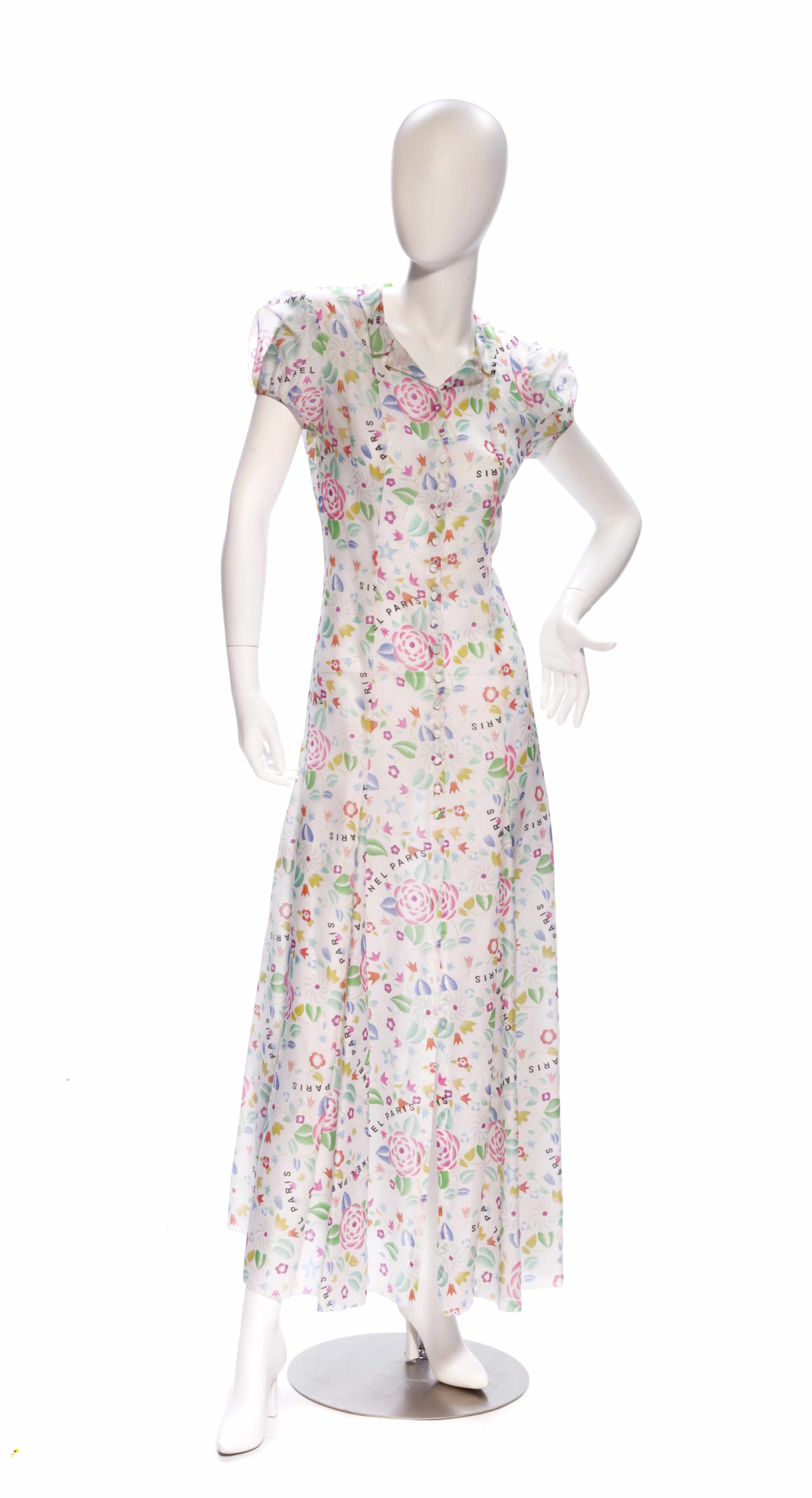 Appraisal: A Chanel long white floral design dress with short sleeves