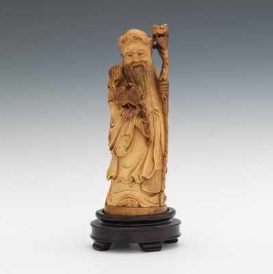 Appraisal: A Carved Ivory Figure of an Immortal with Stand Nicely