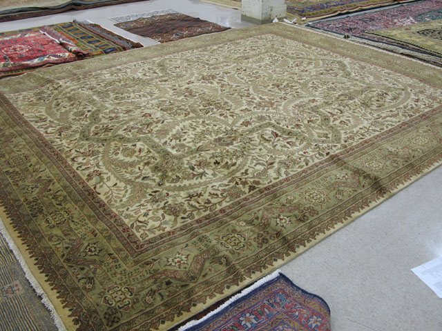 Appraisal: ORIENTAL INDO-PERSIAN GRAND ROOM CARPET decorated with scrolling vines in