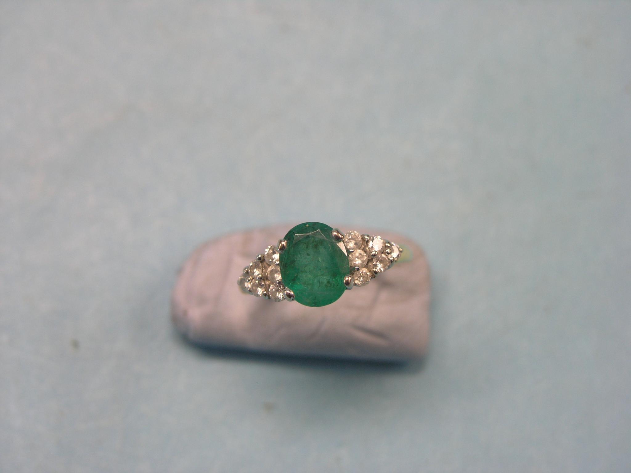 Appraisal: An ct gold dress ring set large central faceted emerald