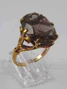 Appraisal: A ct gold dress ring set with quartz