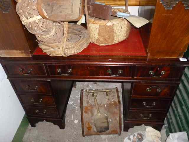 Appraisal: A MAHOGANY PEDESTAL DESK with red leather inset top wide