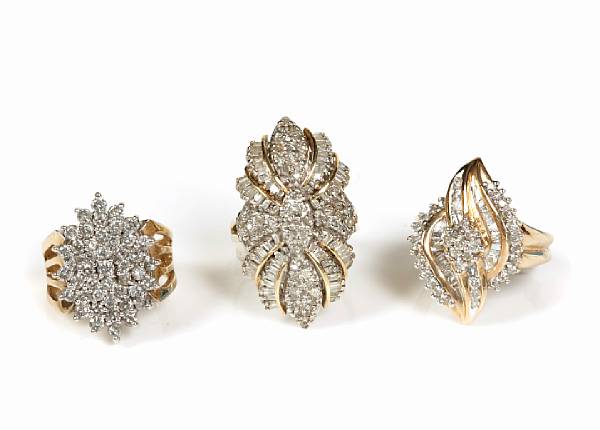 Appraisal: A collection of three diamond and gold cluster rings grs