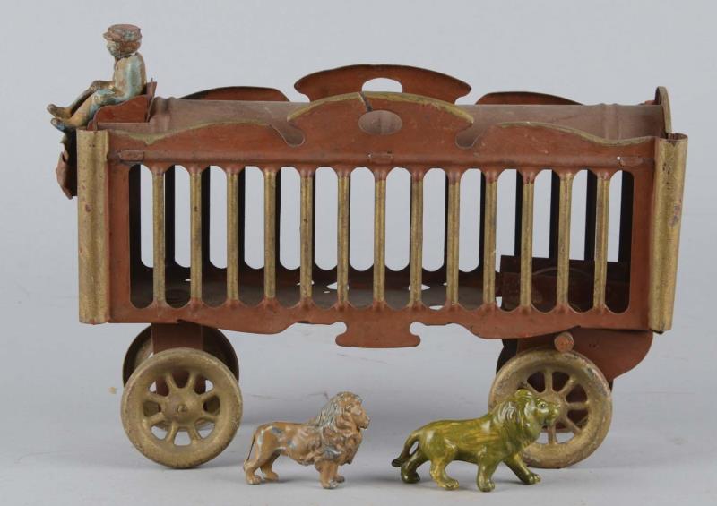 Appraisal: Pressed Steel Circus Wagon Toy Includes driver and two painted