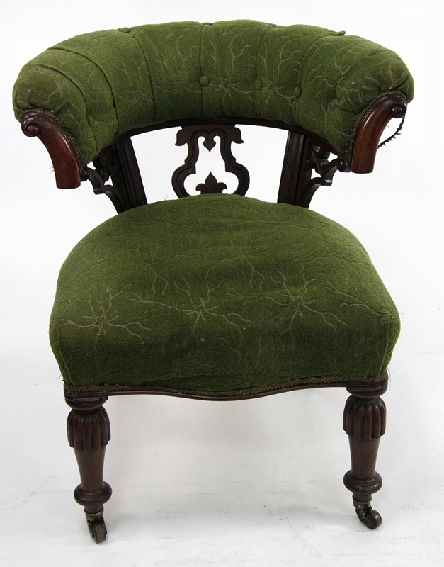 Appraisal: A Victorian walnut tub-shaped armchair with scroll terminations to the