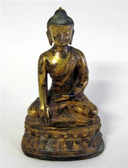 Appraisal: Sino Tibetan gilt copper figureModeled as a seated Buddha