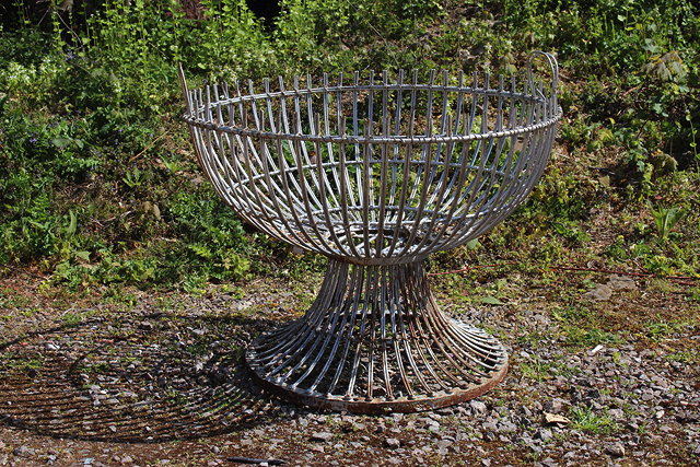 Appraisal: A LARGE SILVER PAINTED WROUGHT IRON PLANTER on a spreading