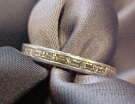 Appraisal: Platinum and Diamond Band half channel-set with diamond baguettes engraved